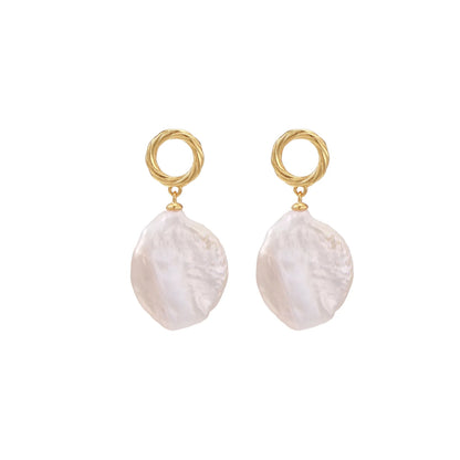 18K gold vermeil twisted circle studs with organic white baroque pearl drops on cream background
