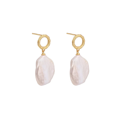 18K gold vermeil twisted circle studs with organic white baroque pearl drops on cream background