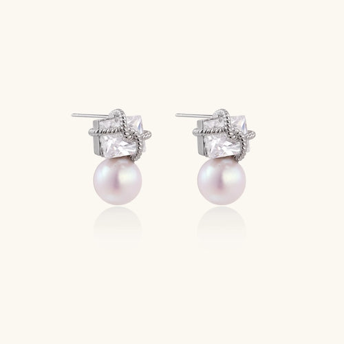White gold stud earrings with square crystal stones in twisted frames and pink freshwater pearl drops below