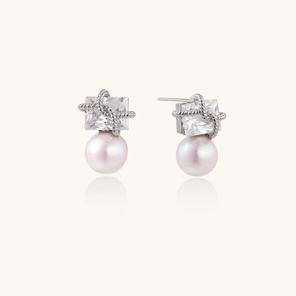 White gold stud earrings with square crystal stones in twisted frames and pink freshwater pearl drops below