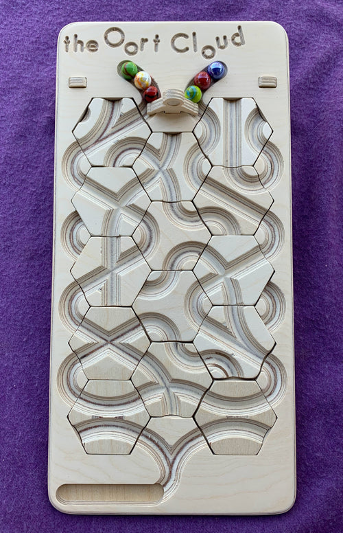 The Oort Cloud: A Marble Run Puzzle Game